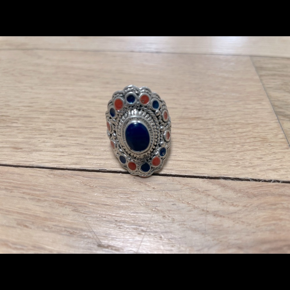 Large Silver Ring with stone detail.